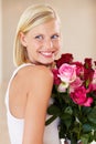 Woman, rose bouquet and smile with face, beauty and arrangement with studio background, happy and gift. Look, female