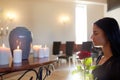 Woman with rose and funerary urn at church Royalty Free Stock Photo