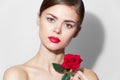 Woman with rose Red lips charm bare shoulders makeup Royalty Free Stock Photo