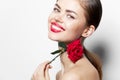 Woman with rose Wide smile red lips charm naked shoulders charm light Royalty Free Stock Photo