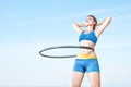 Woman rotates hula hoop Royalty Free Stock Photo