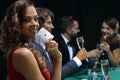 Woman at roulette table holding champagne glass in casino Royalty Free Stock Photo