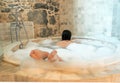 woman in a round bathtube Royalty Free Stock Photo