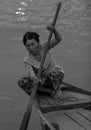 Woman rowing boat in Hoi An