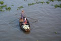 A woman rowing boat at Nga Nam floating market in Soc Trang, southern Vietnam