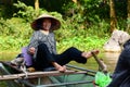 Woman rowing the boat on Ngo river. Tam Coc. Ninh Binh. Vietnam Royalty Free Stock Photo