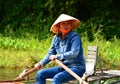 Woman rowing the boat on Ngo river. Tam Coc. Ninh Binh. Vietnam Royalty Free Stock Photo