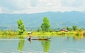 A woman rowing boat on the river in Tra Vinh province, Vietnam