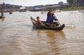 Woman rowing boat, Tonle Sap, Cambodia Royalty Free Stock Photo