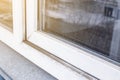 A woman in a rubber glove points to the mold. Plastic window and window sill in mold and dirt. Fungus and dampness at the wet Royalty Free Stock Photo