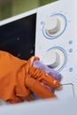 Cleaning microwave in the kitchen Royalty Free Stock Photo