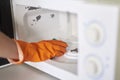 Cleaning microwave in the kitchen Royalty Free Stock Photo