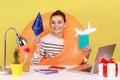 Woman with rubber ring holding passport and Europe Union flag, happy to travel to European countries