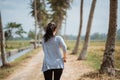 A woman run in side rice field Royalty Free Stock Photo