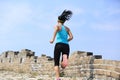 Woman runner athlete running on trail at chinese great wall Royalty Free Stock Photo