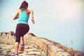 Woman runner athlete running on trail at chinese great wall Royalty Free Stock Photo