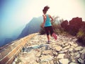 Woman runner athlete running on trail at chinese great wall Royalty Free Stock Photo