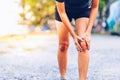 Woman runner hold her sports injured knee Royalty Free Stock Photo