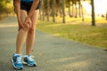 Woman runner hold her sports injured knee Royalty Free Stock Photo