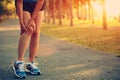 Woman runner hold her sports injured knee Royalty Free Stock Photo