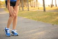 Woman runner hold her sports injured knee Royalty Free Stock Photo