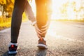 Woman runner hold her sports injured leg. Closeup of leg outdoor Royalty Free Stock Photo