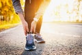 Woman runner hold her sports injured leg. Closeup of leg outdoor Royalty Free Stock Photo