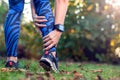 Woman runner hold her sports injured leg. Sport, medicine and pe Royalty Free Stock Photo