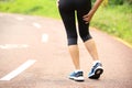 Woman runner holder her sports injured legs Royalty Free Stock Photo