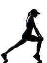 Woman runner jogger stretching warm up silhouette Royalty Free Stock Photo