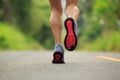 woman runner legs running on tropical forest trail Royalty Free Stock Photo