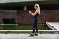 Woman runner prepare performance tracking on smartphone before running