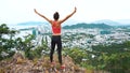 Woman runner raise hands up in the air. Female run on top of the mountain, cheering in winning gesture. Royalty Free Stock Photo