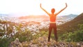 Woman runner raise hands up in the air. Female run on top of the mountain, cheering in winning gesture. Royalty Free Stock Photo