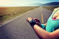 woman runner ready to run set and looking at sports smart watch