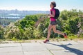 Woman runner run commutes to work with backpack, city morning run commuting and fitness concept Royalty Free Stock Photo
