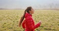 Woman runner running in fall autumn fields. Healthy lifestyle concept. Active sportive people