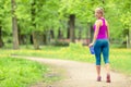 Woman runner running jogging in green summer park and woods Royalty Free Stock Photo