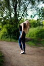 Woman runner running jogging in summer park, throw up head. Royalty Free Stock Photo