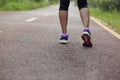 Woman runner running legs at forest trail Royalty Free Stock Photo