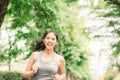 Woman runner running outdoor in a park for health Royalty Free Stock Photo