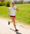 Woman runner runs - workout in spring