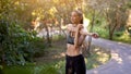 Woman runner stretching arms before exercising summer park  morning Royalty Free Stock Photo