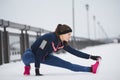 Woman runner stretching legs before run. Young athlete woman working out. Fitness concept. Royalty Free Stock Photo