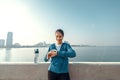 Woman runner takes a break after jogging in the morining