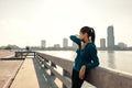 Woman runner takes a break after jogging in the morining Royalty Free Stock Photo