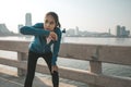 Woman runner takes a break after jogging in the morining