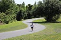 Woman Running Alone on S-Shaped Path