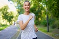 Woman running asphalt road summer park Royalty Free Stock Photo