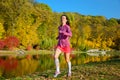 Woman running in autumn park, beautiful girl runner jogging outdoors Royalty Free Stock Photo